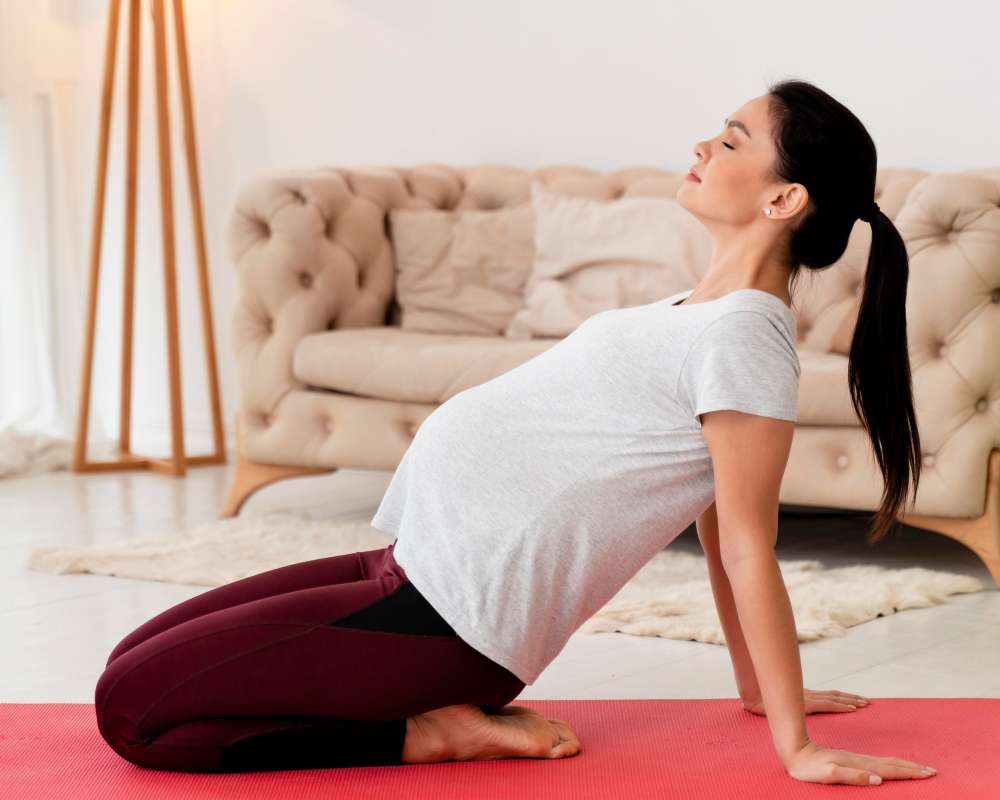 side view young pregnant woman exercising fitness mat