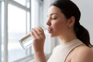 woman drinking water after exercise 23 2149240213